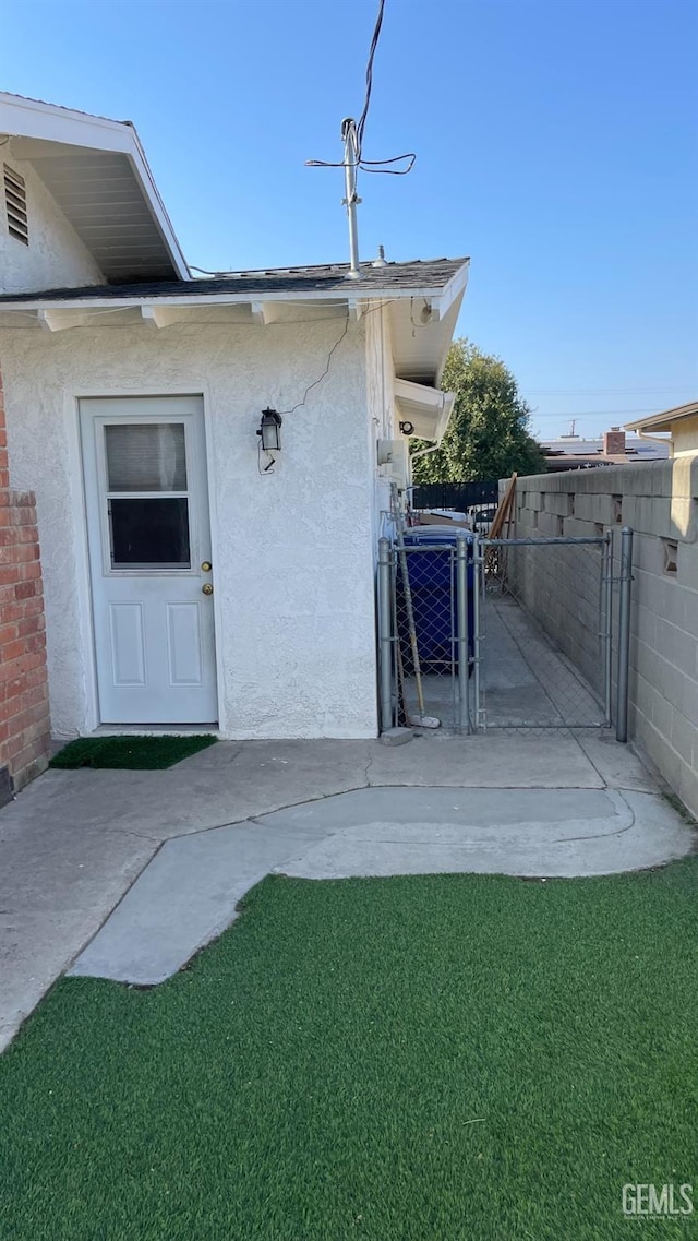 exterior space with a patio area and a yard