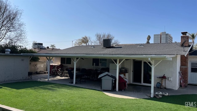 back of house featuring a patio area, a yard, and central air condition unit