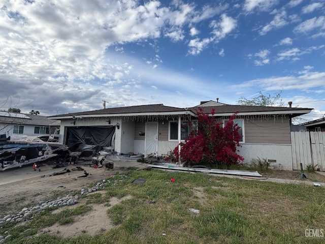 view of front of property featuring a garage and stucco siding