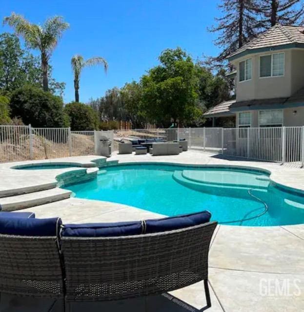 view of pool featuring a patio area