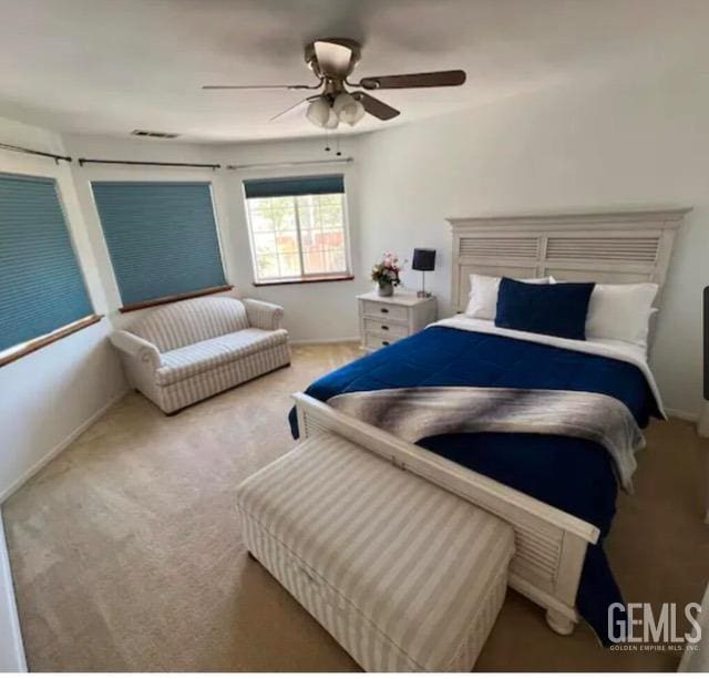 bedroom with ceiling fan and carpet