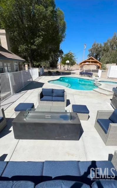 view of swimming pool featuring a patio area