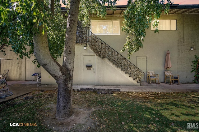 1102 Oleander Ave, Bakersfield, CA 93304 - doorway to property featuring stucco siding and a patio