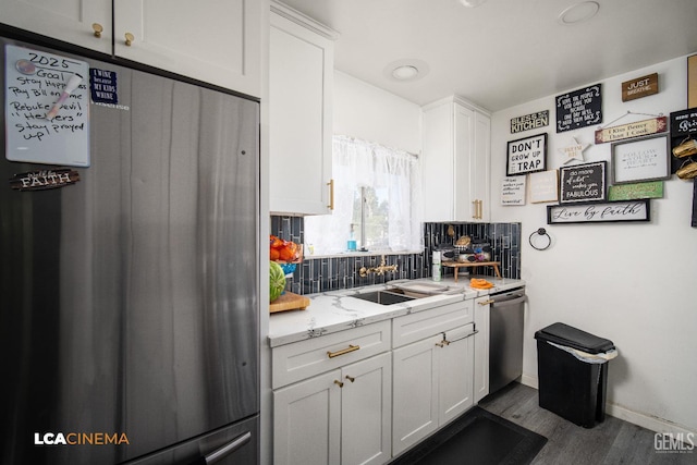 1102 Oleander Ave, Bakersfield, CA 93304 - kitchen with stainless steel appliances, backsplash, white cabinetry, and dark wood finished floors