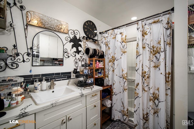 1102 Oleander Ave, Bakersfield, CA 93304 - full bathroom with a shower with curtain, backsplash, and vanity