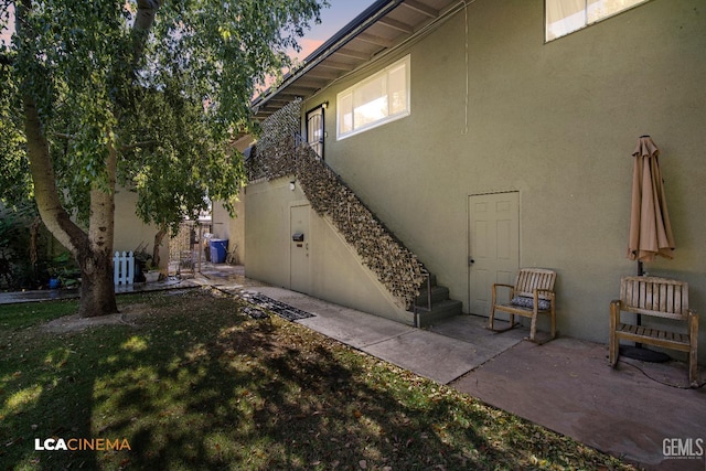 1102 Oleander Ave, Bakersfield, CA 93304 - view of side of home featuring stucco siding and a patio