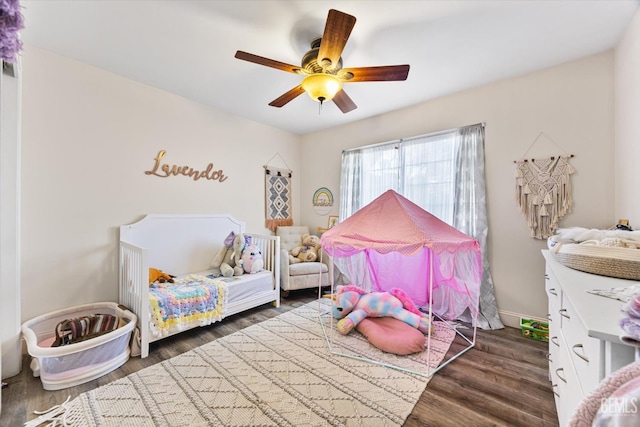 bedroom featuring dark wood-type flooring and ceiling fan