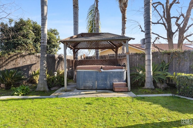 view of yard with a gazebo and a hot tub