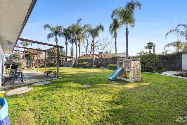 view of yard featuring a gazebo, a patio area, and a playground