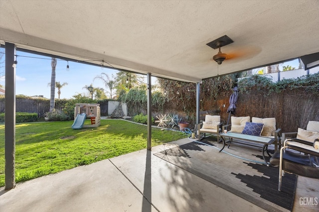 view of patio / terrace featuring an outdoor living space and a playground