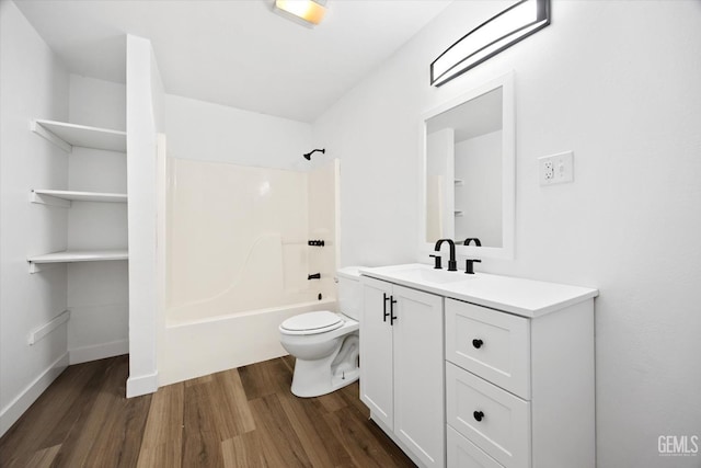 full bathroom featuring wood-type flooring, toilet, tub / shower combination, and vanity