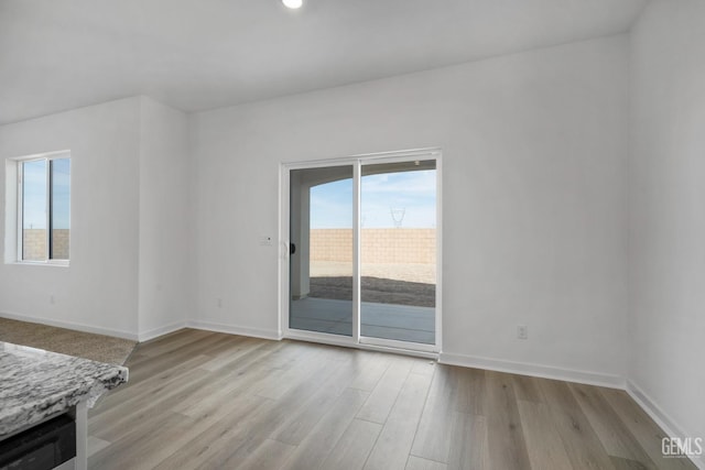 unfurnished room featuring light wood-type flooring