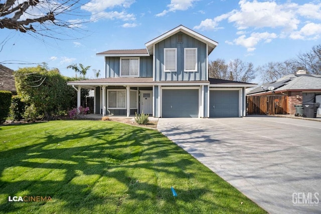 view of front of home with a porch, fence, driveway, board and batten siding, and a front yard