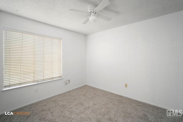 unfurnished room with a textured ceiling, ceiling fan, carpet flooring, and baseboards