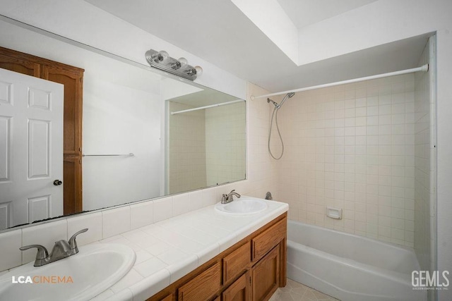 full bath featuring double vanity, a sink, and shower / bathtub combination