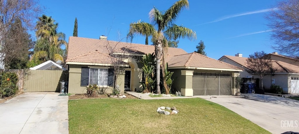 single story home with a garage, a tiled roof, concrete driveway, and stucco siding