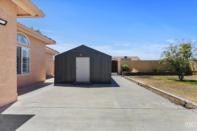 200 Justin Ct, Shafter, CA 93263 - fenced backyard with a storage shed and a patio