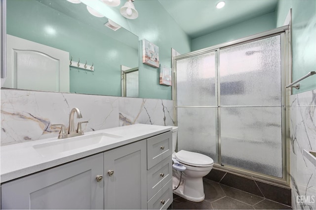200 Justin Ct, Shafter, CA 93263 - full bathroom with tile walls, tile patterned flooring, vanity, a shower with door, and a wainscoted wall