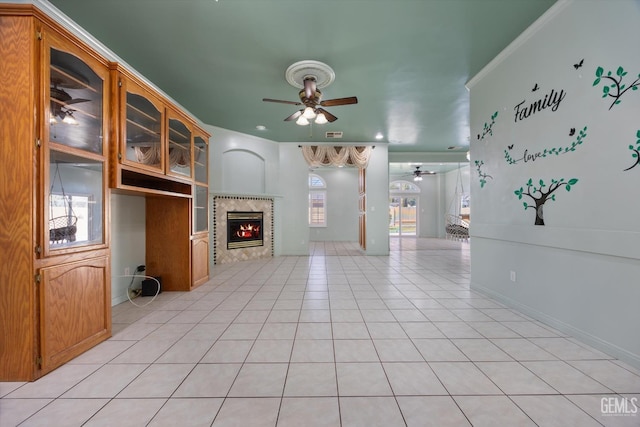 200 Justin Ct, Shafter, CA 93263 - unfurnished living room featuring ceiling fan, a tiled fireplace, and light tile patterned floors