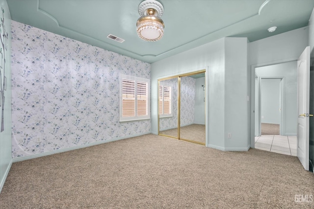 200 Justin Ct, Shafter, CA 93263 - unfurnished bedroom with carpet floors, a closet, and wallpapered walls