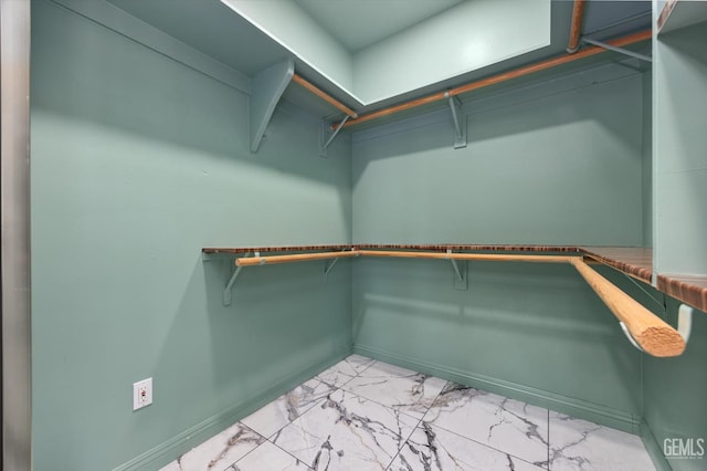 200 Justin Ct, Shafter, CA 93263 - walk in closet featuring light marble finish flooring
