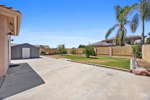 200 Justin Ct, Shafter, CA 93263 - fenced backyard with a patio area and a storage shed