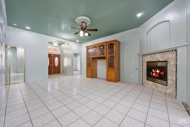 200 Justin Ct, Shafter, CA 93263 - unfurnished living room with a tile fireplace, ceiling fan, crown molding, light tile patterned floors, and recessed lighting