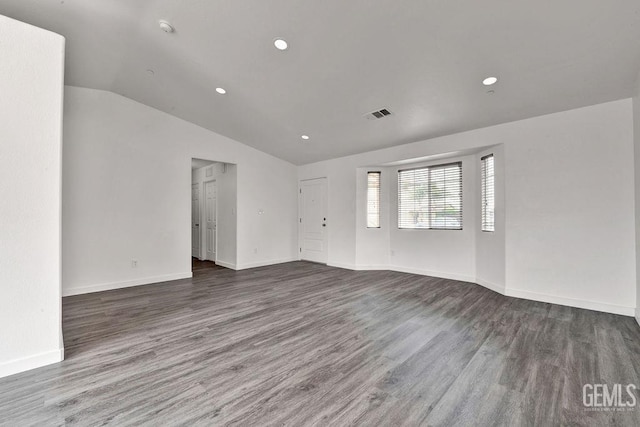 313 Mission St, Mc Farland, CA 93250 - unfurnished room featuring vaulted ceiling, wood finished floors, baseboards, recessed lighting, and a smoke detector