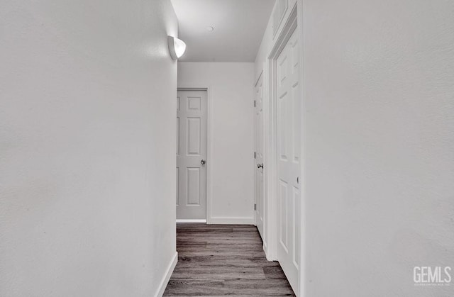 313 Mission St, Mc Farland, CA 93250 - hallway with baseboards and wood finished floors