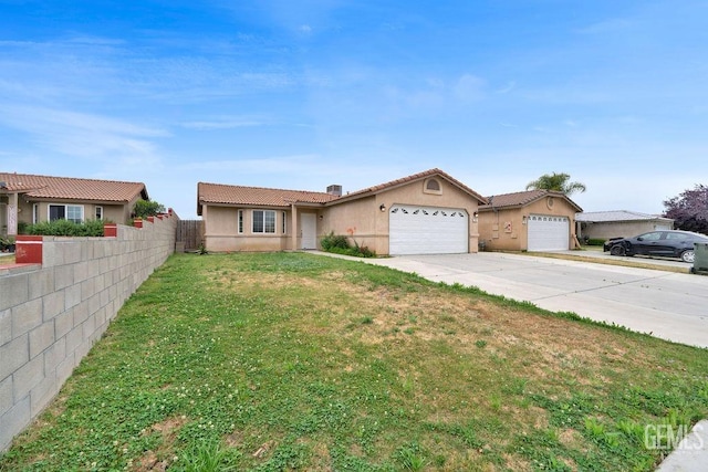 313 Mission St, Mc Farland, CA 93250 - ranch-style house featuring driveway, a front yard, a garage, fence, and stucco siding