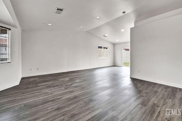 313 Mission St, Mc Farland, CA 93250 - unfurnished room featuring vaulted ceiling, dark wood finished floors, baseboards, and recessed lighting