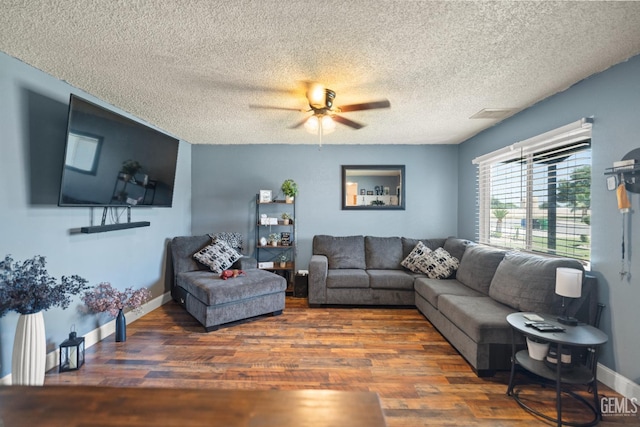 262 Olson Ave, Shafter, CA 93263 - living room with wood finished floors, ceiling fan, and a textured ceiling