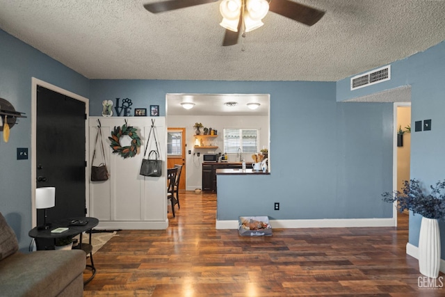 262 Olson Ave, Shafter, CA 93263 - living room featuring a textured ceiling, a ceiling fan, and wood finished floors