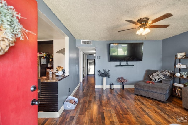 262 Olson Ave, Shafter, CA 93263 - living room with ceiling fan, wood finished floors, and a textured ceiling
