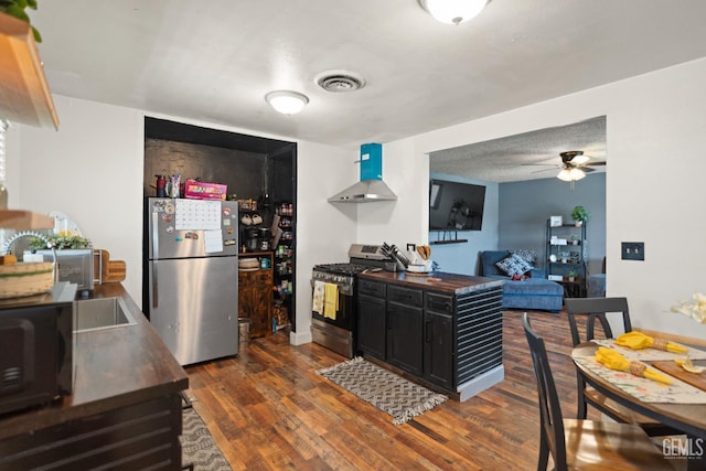 262 Olson Ave, Shafter, CA 93263 - kitchen featuring stainless steel appliances, a ceiling fan, dark wood-type flooring, wood counters, and dark cabinets