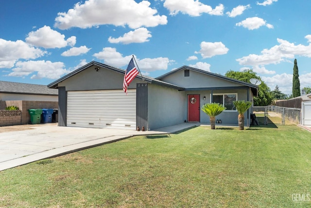 262 Olson Ave, Shafter, CA 93263 - ranch-style house featuring a garage, driveway, a gate, and stucco siding