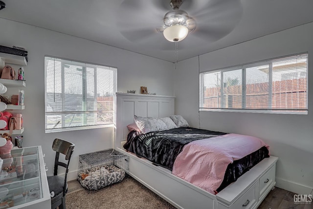 bedroom featuring wood-type flooring and ceiling fan