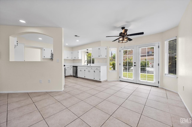 6209 Ambergrove St, Bakersfield, CA 93313 - unfurnished living room featuring a ceiling fan, light tile patterned flooring, french doors, arched walkways, and recessed lighting