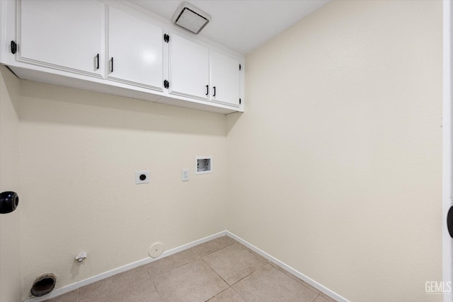 6209 Ambergrove St, Bakersfield, CA 93313 - laundry area with gas dryer hookup, cabinet space, washer hookup, light tile patterned floors, and hookup for an electric dryer