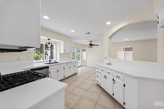 6209 Ambergrove St, Bakersfield, CA 93313 - kitchen with stainless steel dishwasher, a ceiling fan, light tile patterned floors, light countertops, and recessed lighting