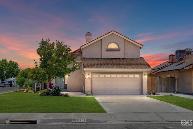 6209 Ambergrove St, Bakersfield, CA 93313 - view of front of home featuring a tiled roof, a chimney, concrete driveway, and stucco siding