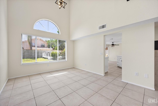 6209 Ambergrove St, Bakersfield, CA 93313 - spare room featuring light tile patterned floors, a high ceiling, and ceiling fan