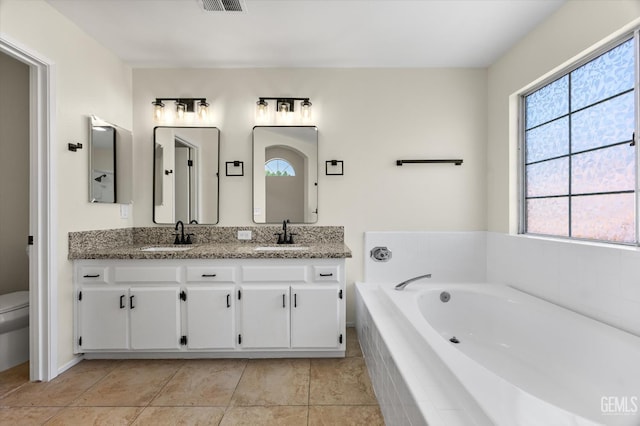 6209 Ambergrove St, Bakersfield, CA 93313 - bathroom featuring double vanity, a bath, plenty of natural light, and tile patterned floors
