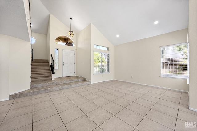 6209 Ambergrove St, Bakersfield, CA 93313 - entryway with tile patterned floors, high vaulted ceiling, stairs, and recessed lighting