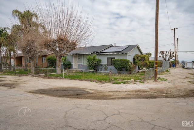 view of front of property with solar panels