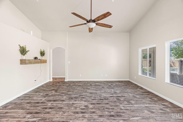 15020 Cotton Blossom Ave, Bakersfield, CA 93314 - empty room with wood finished floors, high vaulted ceiling, ceiling fan, arched walkways, and baseboards