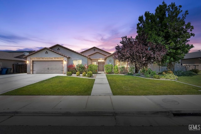 15020 Cotton Blossom Ave, Bakersfield, CA 93314 - mediterranean / spanish-style home with a yard, driveway, a garage, and stucco siding