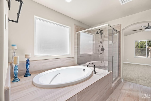 15020 Cotton Blossom Ave, Bakersfield, CA 93314 - full bathroom with a stall shower, a bath, a ceiling fan, and baseboards