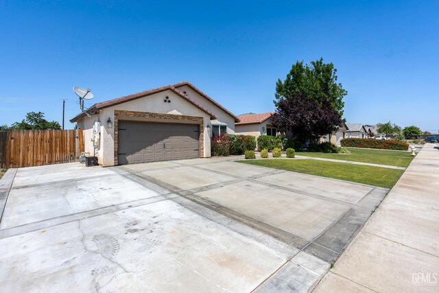 15020 Cotton Blossom Ave, Bakersfield, CA 93314 - view of front of house featuring stucco siding, a garage, concrete driveway, and a tile roof