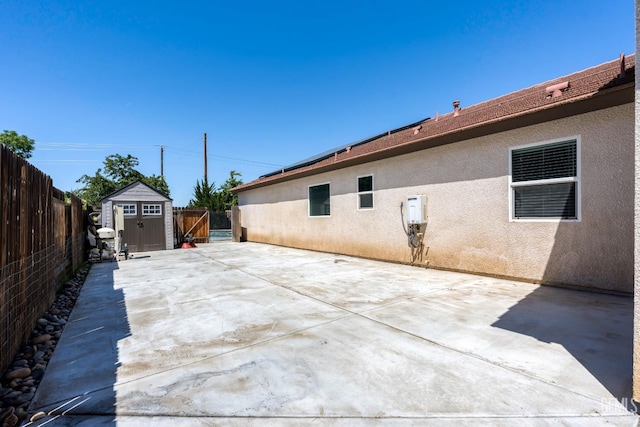 15020 Cotton Blossom Ave, Bakersfield, CA 93314 - view of patio / terrace with a shed, a fenced backyard, and an outdoor structure